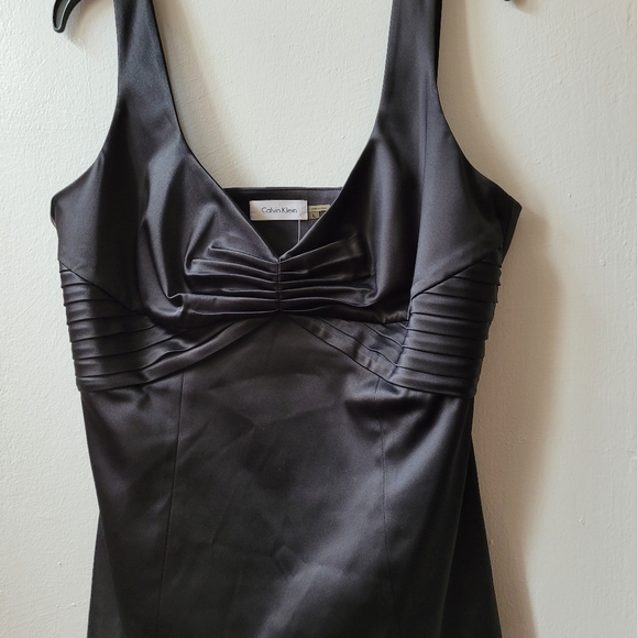 Size L - Calvin Klein dressy black satin top with nice detail at mid chest - Picture 1 of 3